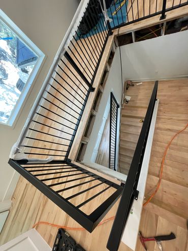 Custom Residential black stairwell handrail