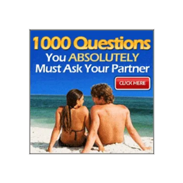 White Man and White Woman sitting on beach looking at each other laying in sand in front of ocean