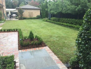 Zoysia sod backyard with gardens