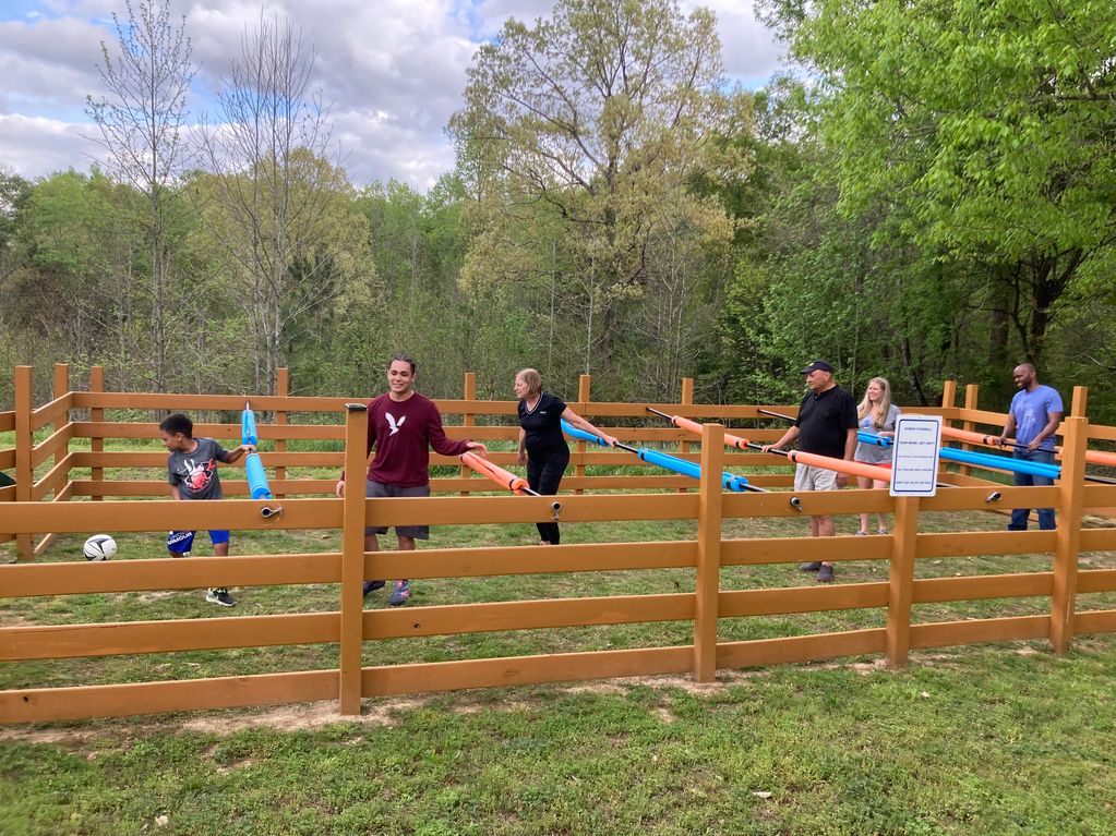 Play Human Foosball! Hang on to the bars and slide back and forth in tandem just like the plastic ve