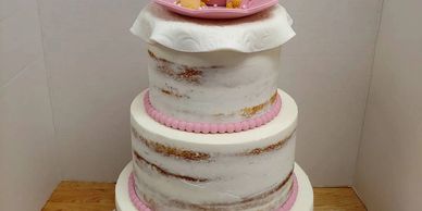 3-tier naked cake with pink teapot and pink accents