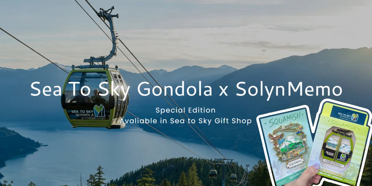 A gondola ride over scenic mountains and lake with souvenir pins shown.