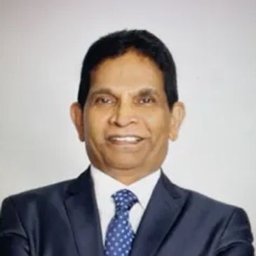 A portrait of a man wearing a formal attire