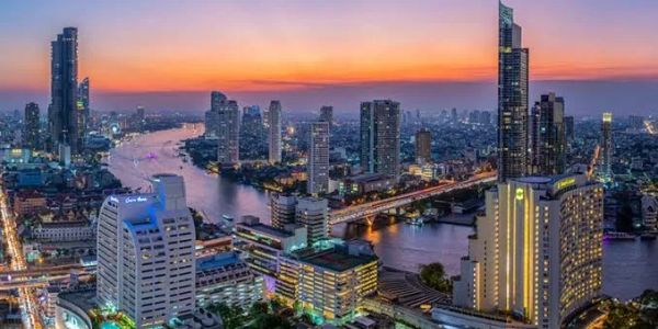 City skyline with river at sunset.