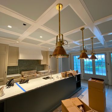 Renovated kitchen with modern lighting.