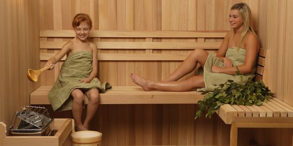 Custom Pre-Cut Sauna with sauna heater, backrest, bucket and ladle.