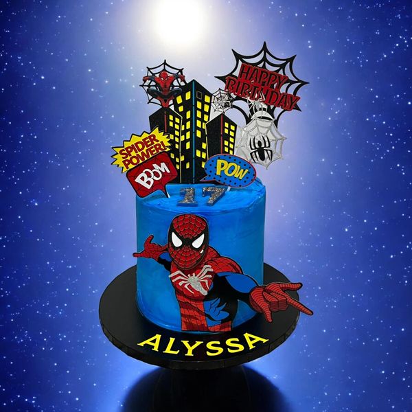 Blue Spiderman-themed birthday cake with comic-style decorations for Alyssa's 17th birthday.