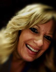Owner of Gloriana LLC, Kim Shillinger, smiling at camera