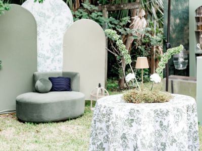 Cozy outdoor seating area with a floral table.
