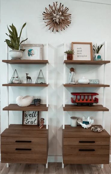 Wooden shelves with plants, decorative items, and inspirational quotes.