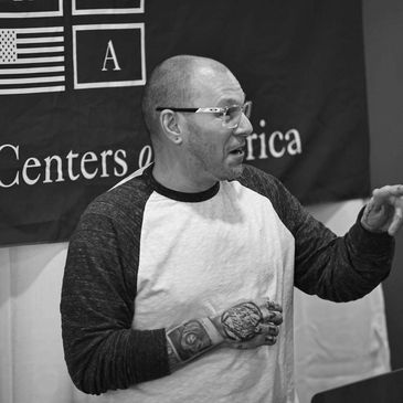 Dr. Joey Pagano delivering a professional training session at Recovery Centers of America.