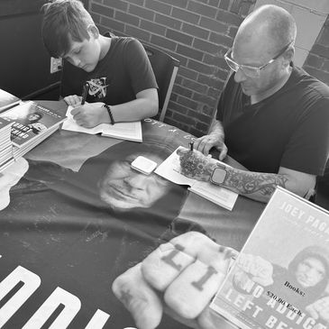 Dr. Joey Pagano and his brother Xavier at a heartfelt book signing event.