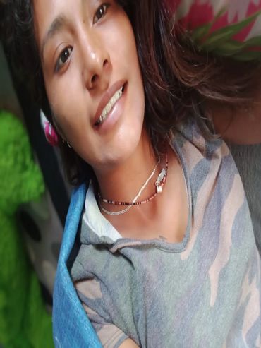 Yorely smiling with new front teeth.