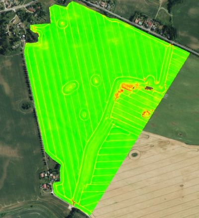 Aerial view of a field with green and yellow heatmap overlay.