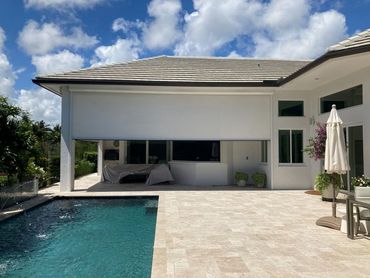 Exterior Retractable Screen by the poolside and patio