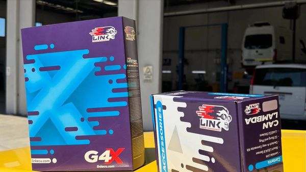 Two Link G4X product boxes on a yellow surface.