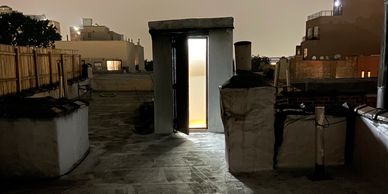 Rooftop in Brooklyn on a cloudy night. Artistic lighting.