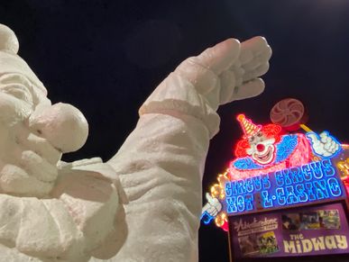 Neon signage and clown sculpture in front of Circus Circus. in Las Vegas.