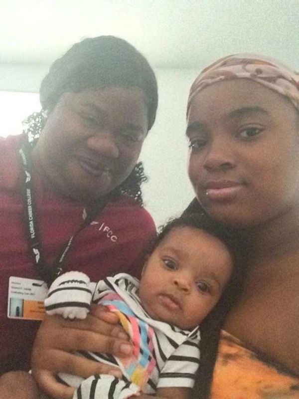 Three people: two women and a baby.