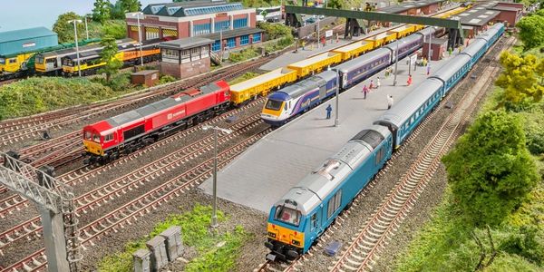 Model train set with detailed layout and multiple trains.