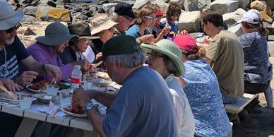 Group of people smiling and eating