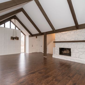Old 70's A frame given new life with smooth ceilings, feature wall, and new wood flooring.