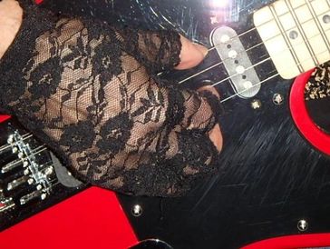 Hand playing guitar strings