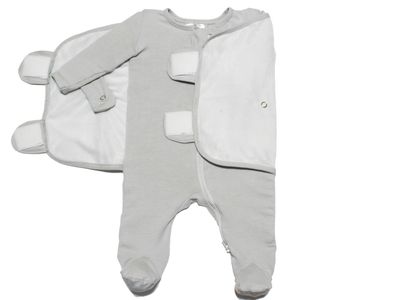 Onesie Swaddle secures infant's arms so they cannot break free during the baby swaddling process.