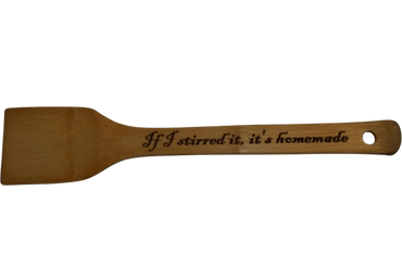 Wooden spatula with the phrase 'If I stirred it, it's homemade'.