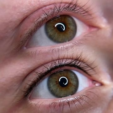 Lashline enhancement immediately after eyeliner tattoo treatment.