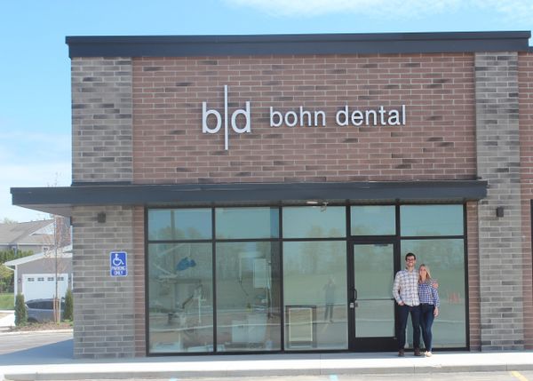 Dr. Keegan and Abby in front of bohn dental.