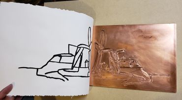 The plate and paper showing how the artist had to make a reverse image in copper.