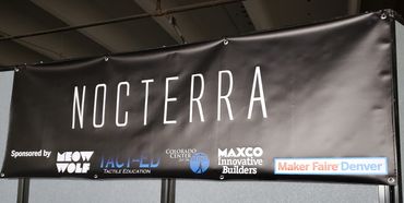 Banner at Maker Faire Denver advertising Nocterra.