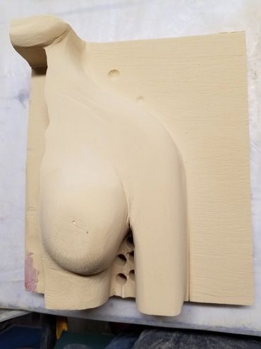 More refined sculpting of the torso.