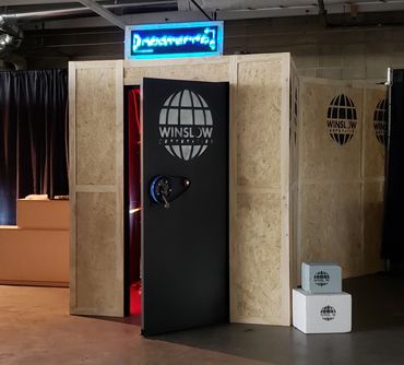 The black front door of Nocterra with white Winslow Corp logo.