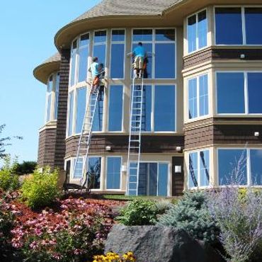 Working on a residential window cleaning job example.