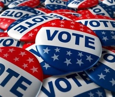 Red, white, and blue vote buttons with stars.
