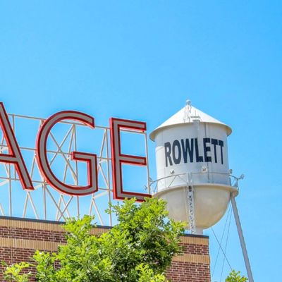 Rowlett TX the old historical water tower stands behind the new Village of Rowlett located off of Ma