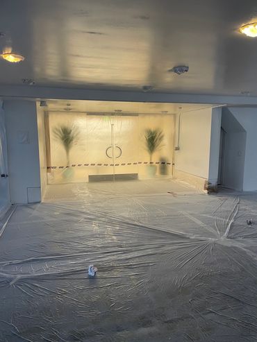 Luxury store entrance under renovation with clean design.