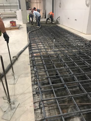 Commercial remodeling with concrete slab construction and rebar reinforcement.