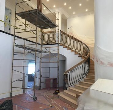Luxury home remodeling with elegant staircase and quality construction services.