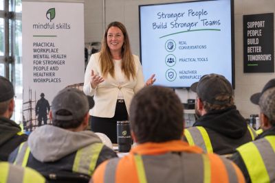 Katie Pope facilitating a workplace discussion about communication and psychological safety