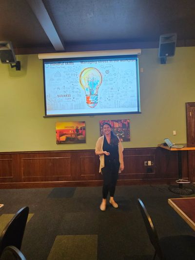 Katie posing after one of her culture presentations to a wide audience