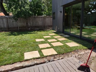 Leveling, sod and stepping stone installation