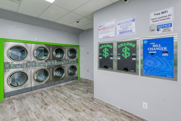 Machines for quarters and to change large bills at Mary’s Laundromart.