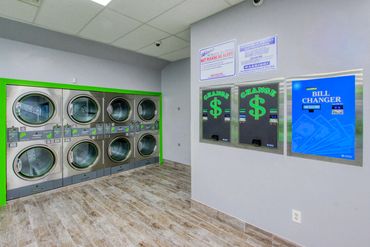 Coin and bill changers at Mary’s Laundromart in Lauderdale Lakes.