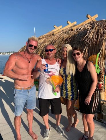 A group of people enjoying their time on the tiki boat