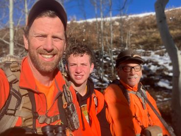 Mike Talia hunting with his son and father.