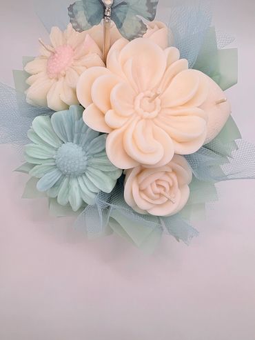 Soft baby blue and cream colored candle flowers with tulle and real baby breath. Bouquet arrangement