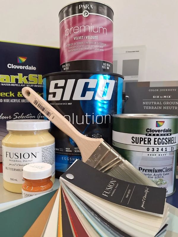 Photo of selection of paint and paint supplies
